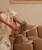 create an image using the first image and have her wearing the boots in the second and third image