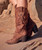 Our Kyle western boot features a 2 3/4" high heel, hardware embellishments and lovely handmade leather details.

Created in this stunning brown flower engraved suede leather with on tone details, lightly washed and tinted with our cutting-edge vintaging technique providing a strong and innovative look.

Vintage Treatment
100% Calf suede
Handmade Stitching
Hand-inserted details
Metal details 100% nickel-free
Leather details
Leather sole
Made in Italy