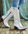 Leather upper
Snip toe
15" shaft height
Solid metallic silver design with western stitching
2.25" western heel
Interior zipper closures
Leather outsole with rubber heel cap
Single-stitched welt
Imported
Lane logo hardware on heel