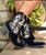 Model: BL3873-2

Color: Suede Black/White

Toe: Sintino-4

Heel: Sintino

Height: 7"

Leather: Suede

GENERAL INFORMATION
Our cowboy boots bond the time-honored art of handmade boots with a contemporary flair for fashion. Old Gringo Boots are unique, comfortable and made with the highest quality leathers. We add art to footwear using embroidery, Swarovski crystals, stud patterns, inlay/overlay, hand tooling, painting, and laser etching techniques. Every Old Gringo boot is the culmination of an over 250-step production process performed by our skilled craftsmen. May show use due to being in a show. 