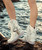 Symbol and icon par excellence of the brand, Arya has defined the recent history of El Vaquero becoming the leading character of its tale of freedom and wildness. Featuring our signature handmade stitching, side fringing and hardware embellishments, the Arya boot is presented in this revolutionary combination of prime quality winter white denim and ghost brushed leather.

Hidden wedge 3 inch
Vintage Treatment
100% Jeans and Calf 
Handmade Stitching
Hand-inserted details
Metal details 100% nickel-free
Rubber sole
Made in Italy