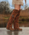Coleen – The Statement Over-the-Knee Boot

A must-have for true El Vaquero aficionados, Coleen embodies the bold, free-spirited soul of the brand. This striking over-the-knee boot with double-layer shaft turns heads with its signature handcrafted details, flowing side fringing, and refined back lacing.

Presented in Leomarble, an exclusive and innovative blend of Leopard and Marble prints, this warm burnt orange hue evokes the essence of autumn. Expertly washed and treated for a vintage feel, the suede finish adds depth and texture to an already standout silhouette.

Combining artistry with comfort, Coleen features a concealed 2 3/4" wedge, delivering subtle height and effortless wearability—perfect for those who dare to go beyond the ordinary.

Features:

Hidden internal wedge: 2 3/4"

Vintage treatment for a time-worn look

100% calf suede leather

Exclusive Leopard-Marble print

Signature handmade stitching

Nickel-free metal details

Rubber sole for durability and grip

Command attention. Embrace freedom. Coleen isn’t just a boot—it’s a declaration.