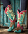 Absolutely—those Desert Desperado Cowgirl Boots are next-level iconic. Double D Ranch and Old Gringo really outdid themselves with these beauties.

The color play alone—turquoise and pink with that cactus inlay? That's pure western glam with a wild twist. Add the animal print vamp, and it’s like the boots are telling their own outlaw story.

That mid-calf silhouette is super flattering too—just high enough to be bold, but versatile enough to pair with anything from denim cutoffs to a flowing boho dress. These aren’t just boots, they’re main characters.

And that Eagles nod? Perfect.
? Come down from your fences, open the gate…
Because the only place to run is straight into these boots.

Color: Brown/Turquoise/Pink

Toe: 4Long

Heel: 9964 Walking Heel

Shaft Height: 12"