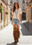 Note - Custom Order sizes due to arrive 90 - 120 days from order date. 

Esme is the knee-high boot from El Vaquero that embodies the free spirit of boho-western. Featuring a 2 3/4" internal wedge, an adjustable back lacing, and a cascade of multi-level fringe, it's embellished with handcrafted stitching and carved details. A dramatic model, designed for those who love to stand out in style. Crafted from this suede calfskin with a vintage finish, enhanced by the renowned Silverstone wash. Each hide is unique, with intense hues and a worn-in effect that tells a story.

Internal wedge 2 3/4"
Vintage Treatment
100% Calf Suede
Handcrafted stitching
100% nickel-free metal details
Rubber sole
Made in Italy