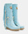 The Billie mid-calf boot features a 2 3/4" internal wedge, soft fringe, beautiful leather side tabs, and thick hand-stitched toecaps, a hallmark of the El Vaquero brand. Finished with the celebrated Silverstone wash, a signature of the El Vaquero brand, which highlights every nuance of the leather in its most intense colors, making each boot unique and one-of-a-kind.

2 3/4" internal wedge
Vintage treatment
100% Calf Suede
Handcrafted stitching
Metallic details 100% nickel free
Rubber sole