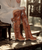 The Coleen boot is a must-have in the wardrobe of every loyal customer of El Vaquero brand. This double layered over-the-knee boot showcases the brand\'s signature handmade stitching on the instep, exquisite fringe detailing and an elegant lace-up back. Crafted in a spectacular mutating calf leather with hand-brushed on-tone details, made to be worn every day in every climatic situation.

Hidden wedge 7 cm
Vintage Treatment
100% Calf leather
Handmade Stitching
Metal details 100% nickel-free
Rubber sole
