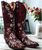 Bloom with every step in these breathtaking Old Gringo boots. Crafted from rich red leather, this statement style is brought to life with vibrant white floral embroidery inspired by delicate cherry blossoms. The bold contrast of color makes these boots a true standout, blending western tradition with feminine artistry.
