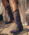 THE OLD GRINGO SORA COWGIRL 13" BOOTS ARE THE PERFECT BOOT FOR ANY OCCASSION, NO MATTER HOW CASUAL OR FANCY! THE SOFT  LEATHER BACKGROUND IS BEAUTIFULLY ACCENTED WITH INTRICIATE, BRIGHT FLORAL EMBROIDERY THAT POPS JUST ENOUGH TO MAKE A DRAMATIC, YET ROMANTIC STATEMENT.  THE TRADITIONAL FASHION HEEL AND TOE WILL MAKE THESE BOOTS THE MOST COMFORTABLE PAIR IN YOUR CLOSET!!!

THE SORA IN VIOLET IS SIMPLY STUNNING!

Toe: 4Long

Heel: 9964

Shaft Height: 13"