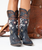 Old Gringo – Spirit Boots | Blue

Wild, free, and fierce—that’s the unmistakable Old Gringo spirit. Designed with a true giddy up attitude, these statement boots celebrate western soul and fearless style. A striking cowgirl atop a hair-on-hide horseback takes center stage, surrounded by rope and star emblems and finished with gleaming silver studs that add just the right amount of edge.

Set against a dark blue distressed leather background, the Spirit Boots blend bold artistry with classic western tradition. The timeless silhouette and neutral-yet-dramatic palette make them endlessly wearable, while their expressive details ensure they’ll always stand out. These are boots you’ll reach for year after year—true icons in any country-inspired collection.
