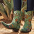 Turn up the charm and kick up a little country soul in these irresistible Double D Ranch by Old Gringo Boots. Inspired by the playful spirit of “Wagon Wheel,” this ankle-height cowgirl boot is pure fun from heel to toe. Crafted in eye-catching turquoise leather, the design is brought to life with floral embroidery, wagon wheel and horseshoe motifs, and studded accents that add just the right touch of Western whimsy.

The flattering snip toe and easy-wearing heel make these boots as comfortable as they are cute, while the shorter shaft keeps the look fresh, flirty, and perfect for everyday wear. Pair them with jeans, dresses, or cutoff shorts and let your inner cowgirl sing — because these boots were made to turn heads and steal hearts.

Measurements:

Shaft Height: 8.5"

Shaft Opening: 13.5" circumference

Heel Height: 1.75"

Toe: Snip

Width: Standard