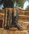 Note - Custom Order sizes due to arrive 90 - 120 days from order date. 

Two toned Cheryl has its own unique persona.  

Longear pull tabs on the side embellished with conchos and braiding on a tan leather gives it a vintage look.

Turquoise finish on the studs makes it a pair of must-have black boots.

Details: Studded, Inlay/Overlay, Braided 

Color: Black 
Brand: Old Gringo
Heel: 9964 (1.625”) 
Toe: Snip Toe
Shaft Height: 13"

Handmade, with 100% leather.