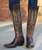 create an image with the full body view of a model in her mid twenties with long highlighted hair and give her a boho western vibe...have her wearing the boots in the 2 thru 4 images, styled together...use the styling of the attached reference images