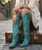 Old Gringo – Austin Boots | Pink/Purple

This is Austin—and we sure do love her. ? New from Old Gringo Boots, this joyful standout is bursting with country-western charm and fearless color. Rich mulberry pink and purple leathers set the stage for an explosion of details, accented with pops of turquoise and yellow for a look that’s bold, playful, and undeniably fun.

Stars, hearts, arrows, florals, gleaming studs—Austin has it all. Finished with full side zippers for easy on-and-off and designed in a flattering mid-calf silhouette, she’s effortlessly wearable year-round. Whether styled with denim, dresses, or cutoffs, these boots deliver the perfect cowgirl statement every time.

Measurements:

Shaft Height: 12"

Shaft Opening: 13.5" circumference

Heel Height: 1 ¾"

Toe: Snip

Bright, spirited, and full of personality—Austin is western style with a wink. ?✨