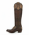 ## Old Gringo Aster Brass Hand-Tooled Tall Western Boot

Bold, elegant, and unmistakably Old Gringo, the **Aster Brass** is a stunning showcase of artisan craftsmanship. Rich brass leather is beautifully contrasted with hand-tooled tan leather overlays featuring intricate floral patterns, creating a timeless Western design with exceptional depth and character. Every detail is carefully handcrafted, making this boot a true statement piece that will turn heads wherever you go.

The dramatic **18-inch knee-high shaft** offers a flattering silhouette, while the signature **Sintino heel** and **Sintino-4 toe** provide a refined Western profile that's both stylish and comfortable. Whether paired with your favorite skinny jeans, a flowing dress, or layered with boho-inspired pieces, the Aster Brass effortlessly transitions from everyday wear to special occasions.

Handcrafted in Mexico using premium leathers and traditional techniques, each pair reflects the quality and individuality that has made Old Gringo one of the most sought-after names in luxury Western footwear.

### Details

* Handcrafted in Mexico
* Premium brass leather construction
* Hand-tooled tan leather overlays with floral detailing
* Intricate artisan tooling throughout
* Decorative buckle harness accents
* Approximately 18-inch shaft height
* Sintino heel
* Sintino-4 toe
* Leather outsole
* Signature Old Gringo craftsmanship

**Please Note:** Every pair of Old Gringo boots is individually handcrafted using premium natural leathers. Variations in color, tooling, leather grain, distressing, and hand-finishing are part of the authentic character of each pair, ensuring every pair is truly one of a kind.
