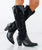 Tessa Knee High - Jet Black
The Tessa Knee High in Jet Black is pure power. Sleek, bold, and unapologetically fashion-forward, this boot was made for nights that run late and entrances that don’t go unnoticed.

With a sky-high 3.5” heel, Tessa is our tallest heel ever, designed to elevate your look (and your confidence). Crafted from luxurious top grain leather and supple suede, she features hand-finished buckstitch edging and statement floral embroidery that brings texture and attitude to an otherwise timeless black boot.

The slim, leg-lengthening fit and modern stovetop silhouette create a striking profile, while the side zip ensures effortless wear—even with that sleek ankle fit.

This isn’t just a black boot. This is the black boot.

Heel Height: 3.5" (highest heel we offer)
Shaft Height: 17.5”
Calf Circumference: 15.4"
Ankle Circumference: 12"
Toe Shape: Snip
Signature Turquoise Soles
Side zipper for easy on/off