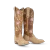She's romantic, collectible, and unapologetically vintage. The Kenzie in Latte Suede and Burnt Caramel was born from a love of heavily embellished retro Western boots — the kind passed down, kept forever, and pulled out for every occasion that matters. A warm two-tone leather body grounds the silhouette in sunbaked, golden-hour tones, while inlaid floral motifs and meticulous embroidery climb the shaft in patterns that feel both heirloom and entirely her own.

Contrast piping defines every line. A classic toe bug sits proudly on the vamp. Even her pull tabs are finished with their own delicate inlay and embroidered detail. With an almond toe, a classic Western heel, and a sexier 16" shaft, she's a fresh take on the boots women fall in love with and never let go.


FIT NOTE: Designed with a slimmer, more tailored shaft for a sleek, leg-lengthening look. This style is a pull-on construction with no zipper.

Specs:

Toe Shape: Almond
Shaft Height: 16"
Shaft Circumference: 15.25"
Ankle Circumference: 11.75"
Heel Height: 1.6"