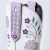 Soft, romantic, and a little flirtatious — the Lovely Lavender Kenzie is the collection's most feminine expression. A delicate two-tone palette of pale lavender and cream sets the stage for inlaid floral motifs and meticulous embroidery that bloom across the shaft like a pressed-flower keepsake.

Contrast piping draws the eye to every curve. A classic toebug grounds the vamp in Western heritage. The pull tabs — inlaid and embroidered with the same care as the rest of her — are a small flourish you'll notice every time you reach for her. Almond toe. Classic Western heel. A sexier 16" shaft. She's a love letter to embellished Western boots, rewritten in lavender.

FIT NOTE: Designed with a slimmer, more tailored shaft for a sleek, leg-lengthening look. This style is a pull-on construction with no zipper.

Specs:

Toe Shape: Almond
Shaft Height: 16"
Shaft Circumference: 15.25"
Ankle Circumference: 11.75"
Heel Height: 1.6"