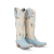 Blueberry Buttermilk Kenzie pairs a soft buttermilk leather body with cool blueberry tones for a two-tone palette that feels fresh, feminine, and pulled straight from a 1970s daydream.

Inlaid floral motifs bloom up the shaft, every petal traced in meticulous embroidery. Contrast piping carves a clean line through the design, and a classic toebug anchors the vamp in true Western tradition. Even her pull tabs are detailed — inlaid, embroidered, and just as considered as the rest of her. With an almond toe, a classic Western heel, and a sexier 16" shaft, she's the kind of boot that earns a permanent spot in your closet.

FIT NOTE: Designed with a slimmer, more tailored shaft for a sleek, leg-lengthening look. This style is a pull-on construction with no zipper.

Specs:

Toe Shape: Almond
Shaft Height: 16"
Shaft Circumference: 15.25"
Ankle Circumference: 11.75"
Heel Height: 1.6"