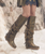 The Coleen boot is a must-have in the wardrobe of every fan of the El Vaquero brand. This incredible boot features a double upper above the knee, typical handcrafted stitching, beautiful side fringes and an elegant lacing on the back. The new Goldenwyrm combination is an absolute novelty: a viper-print vegetable calfskin with hand-padded gold that creates an incredibly revolutionary effect.

Internal wedge 2 3/4"
Viper print vegetable calf
Hand gold infill
Handcrafted stitching
Metallic details 100% nickel free
Leather details
Rubber sole
Made in Italy