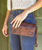 Cadence is a versatile 3-in-1 essential designed to move with you. Crafted from full-grain, vegetable-tanned leather, it transitions effortlessly from wallet to clutch to crossbody with an adaptable strap. Inside, thoughtful organization includes two zippered pockets and dedicated slots for your ID and credit cards, keeping everything neatly in place. Finished with a secure magnetic closure, Cadence makes traveling light feel natural, polished, and entirely uncomplicated.