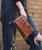 Templeton II is the kind of piece that keeps up. Designed as a 3-in-1 essential, it moves effortlessly from wallet to clutch to crossbody with the simple addition of a strap. Crafted from full-grain, vegetable-tanned leather with rich hand-applied finishes, it carries depth and character in every detail. A smooth zip-around closure offers secure, easy access, opening to interior organization that keeps cards, cash, and essentials neatly in place. Streamlined, versatile, and ready at a moment’s notice, Templeton II makes light travel feel like second nature.