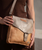 Venice Beach carries an easy confidence shaped by time and texture. Cut from full-grain, vegetable-tanned leather, its structured flap and buckle detail lend a sense of intention to an otherwise relaxed silhouette. The adjustable strap allows for effortless crossbody wear, keeping movement natural and unencumbered. Inside, a thoughtfully proportioned interior keeps daily essentials in place. Equal parts practical and expressive, Venice Beach feels at home wherever the day leads.