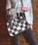 Rockababy SL carries the same compact ease as its original silhouette, thoughtfully scaled for everyday essentials. Crafted from upcycled scrap leather, each piece gives new purpose to what would otherwise be left behind, creating subtle variation and one-of-a-kind character. The streamlined interior keeps things simple, while padded shoulder straps and an adjustable crossbody strap offer versatile, comfortable carry. Finished with a secure zip-top closure and exterior back pocket, it is conscious design without compromise.
