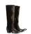 Make a statement from every angle in these striking black suede studded boots, where exotic inspiration meets unmistakable Western attitude.

The dramatic 18-inch straight-cut shaft is crafted from luxe black suede and embellished with intricate mixed-metal studs arranged to recreate the dimensional pattern and movement of python snakeskin. The effect delivers all the exotic appeal of snakeskin in an unexpected, beautifully detailed design.

Smooth black leather on the vamp and heel counter creates a rich contrast against the suede, while a gleaming metallic toe cap adds just enough shine to command attention.

The softly pointed round toe and 2.25-inch tall riding heel create a flattering, elongated silhouette, while the half side zipper makes these tall boots easier to slip on and off.

Bold without being overdone, these 18-inch black Western boots effortlessly move from denim and leather to dresses and skirts. For the woman who loves distinctive boots that won't disappear into the crowd, this is a pair destined to become a favorite.

Details

Color: Black

Leather: Premium suede with contrasting smooth leather

Shaft Height: 18"

Toe: Pointed round

Heel: 2.25" tall riding heel

Closure: 1/2 side zipper

Embellishment: Mixed-metal python-inspired studding

Metallic toe tip

Contrast leather vamp and heel counter

Tall Western-inspired silhouette