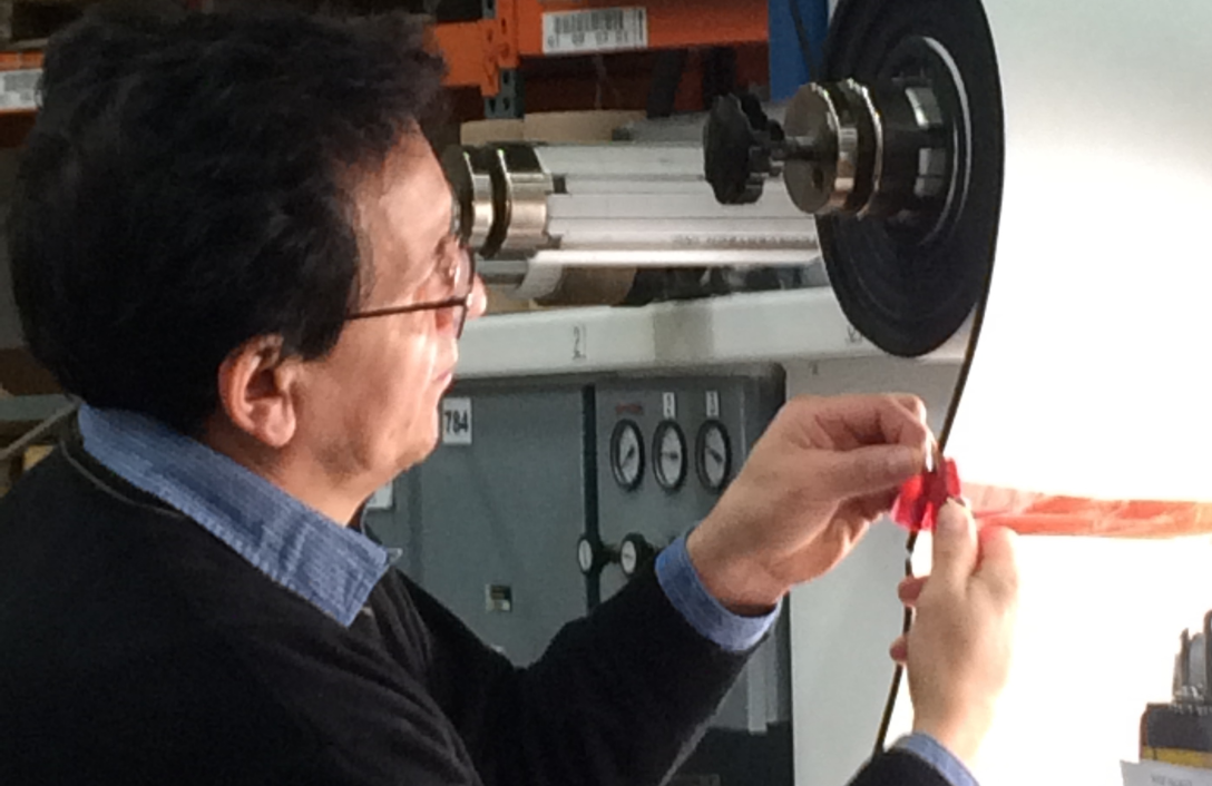 man working with manufacturing equipment