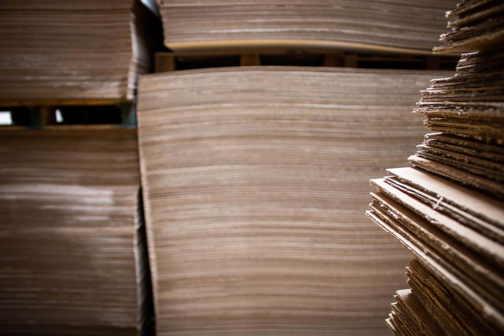 stacks of cardboard in a warehouse