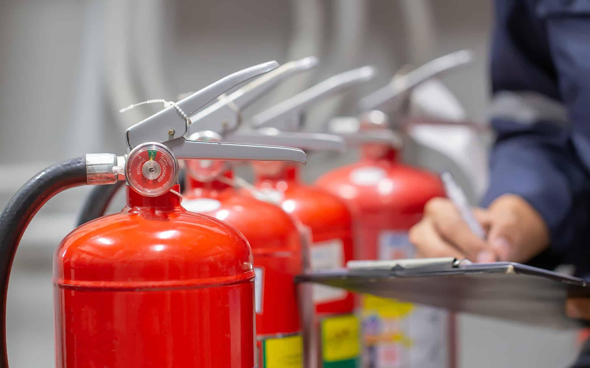 engineer-inspecting-fire-extinguishers.jpg