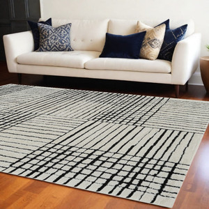 8' X 11' Cream and Black Abstract Distressed Area Rug N270-559023