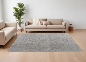 8' X 10' Ivory Tan and Blue Abstract Power Loom Worn Faded Area Rug With Fringe N270-567583