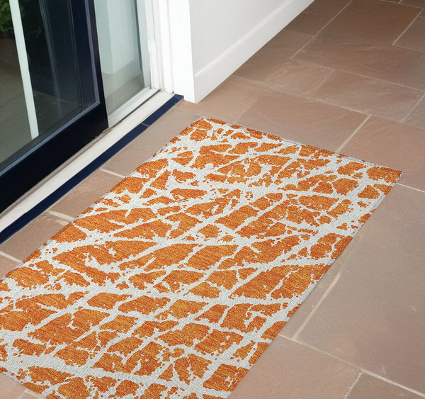 3' X 5' Orange and White Abstract Washable Non Skid Indoor Outdoor Area Rug N270-559283