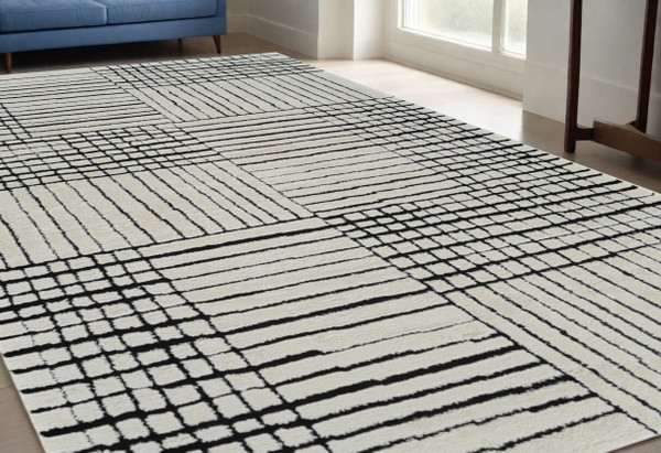 5' X 8' Cream and Black Abstract Distressed Area Rug N270-559021