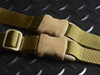Strike Industries SI-S3-SLING-CM S3 Sling (Silent Strategic System), tactical rifle sling with adjustable straps, padded comfort sections, and quick-release buckle, placed on a black textured surface.