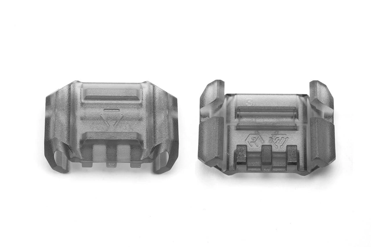Strike Industries SI-AR-CMS-MP Multidirectional Picatinny Rail Cover with Cable Management System, two transparent gray rail covers with textured surface and internal cable management features, pack of 6 pieces.