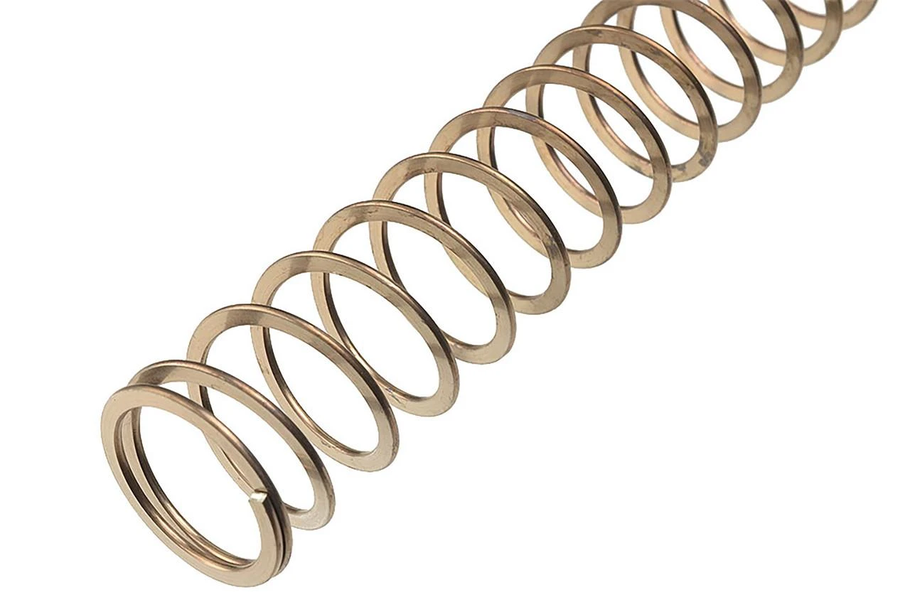 Strike Industries SI-AR-FWS-C AR Carbine Flat Wire Spring, a close-up image of a metallic flat wire spring for firearm components.
