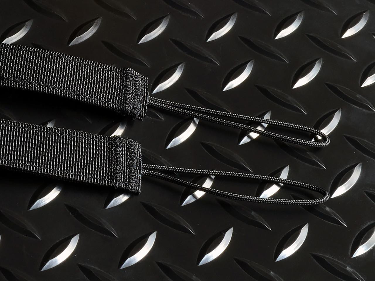Strike Industries SI-S3-SLING-BK S3 Sling (Silent Strategic System), black tactical sling with adjustable straps laid on a textured black metal surface.