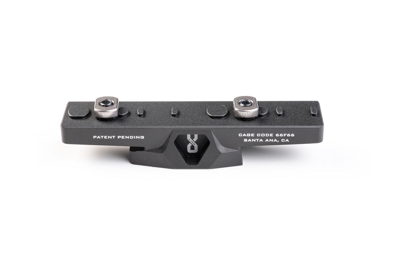 Strike Industries SI-LINK-TRI-ADA LINK Tripod Adapter, black metal attachment with mounting points and screw connections for firearm stabilization.