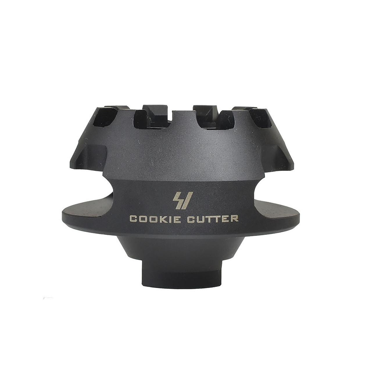 Strike Industries SI-CC-COMP-308 Cookie Cutter Comp for .308/7.62, black firearm muzzle brake with a unique cookie cutter design for enhanced stability and recoil management.