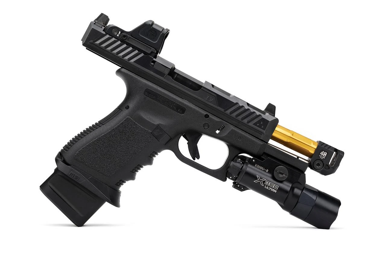 Strike Industries SI-MC-QUAD Micro Threaded Barrel Comp - QUAD, black firearm barrel with gold threading and compact design.