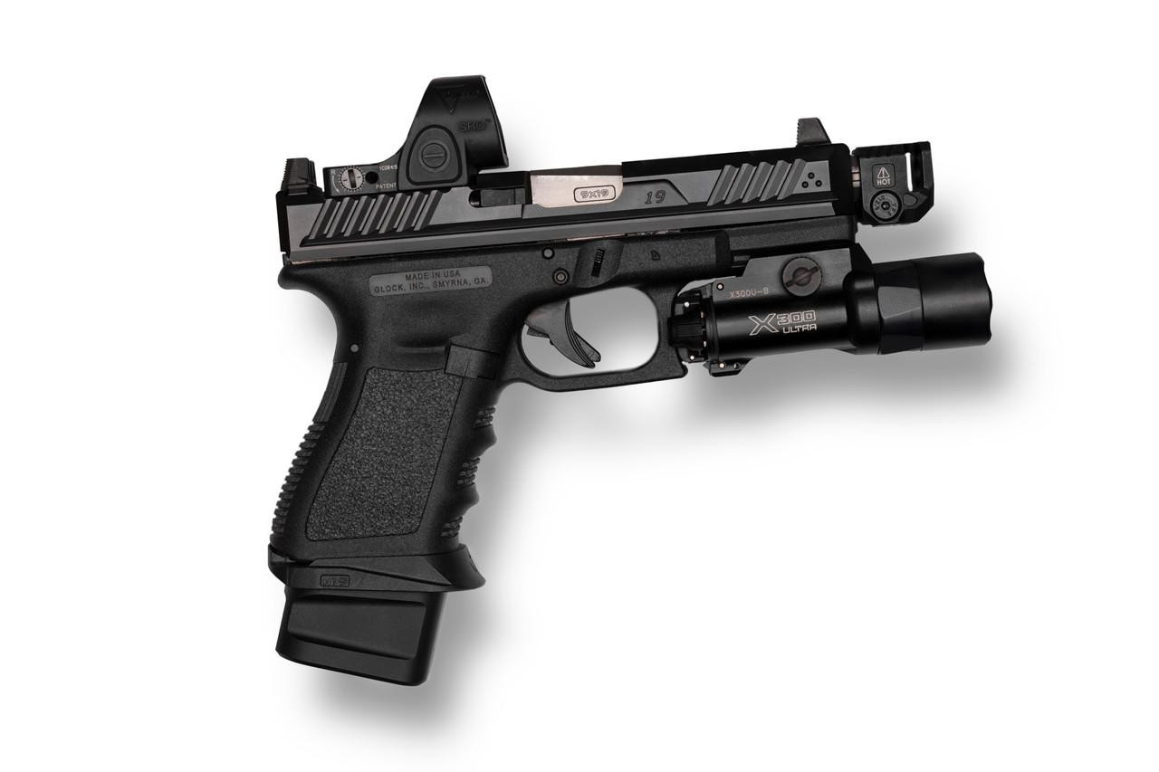 Strike Industries SI-MC-QUAD Micro Threaded Barrel Comp - QUAD, a black handgun with a threaded barrel and tactical sight, designed for firearm accuracy and performance.