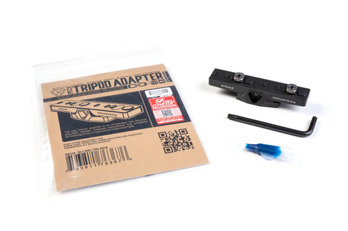 Strike Industries SI-LINK-TRI-ADA LINK Tripod Adapter, shown with packaging, Allen wrench, and protective cap in a flat lay photography style.
