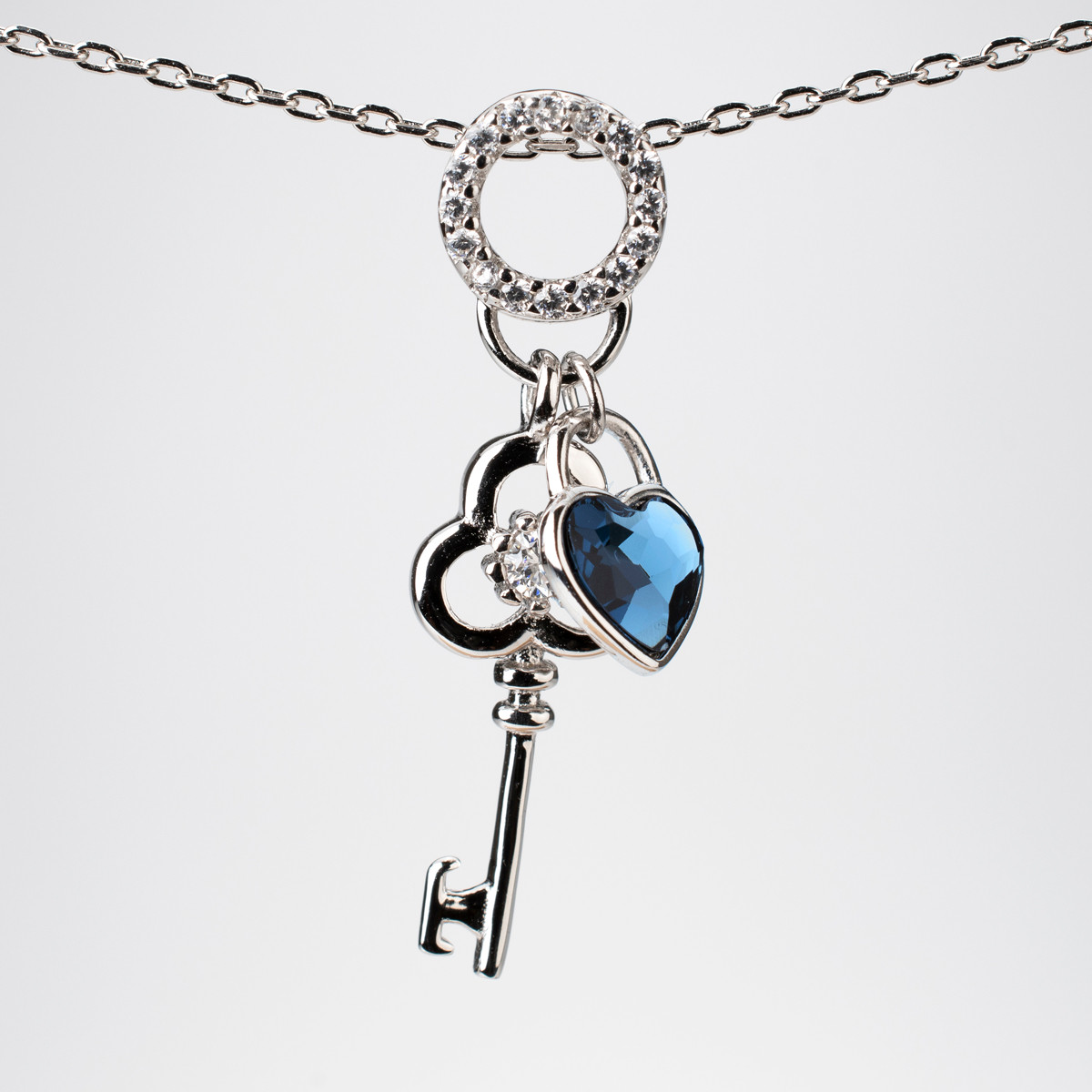 Platinum Plated Necklace with Key and Blue Heart Gemstone Pendant