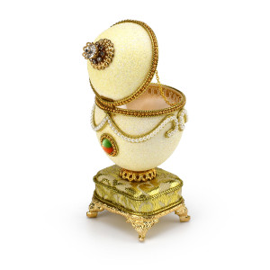 Brilliant Handcrafted Musical Goose Egg with Decorative Broche and Gilded Like Base