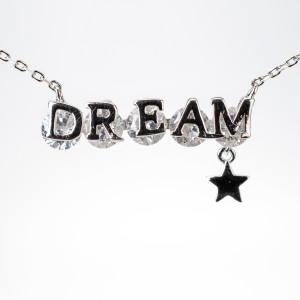 Platinum Plated Necklace with Pendant that reads "Dream" with White Gemstones