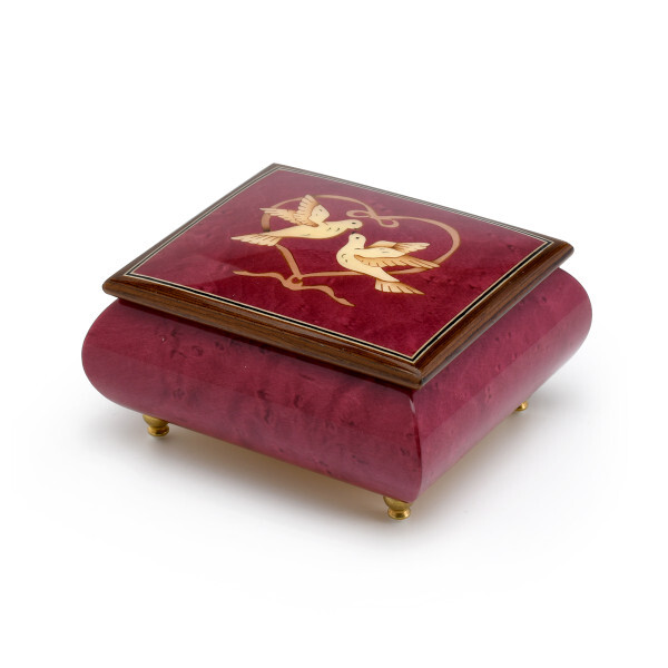 red wine-colored music box with doves and heart ribbon