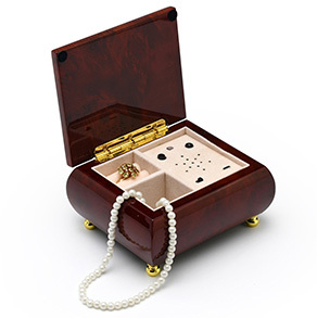 wooden music box with jewelry in it