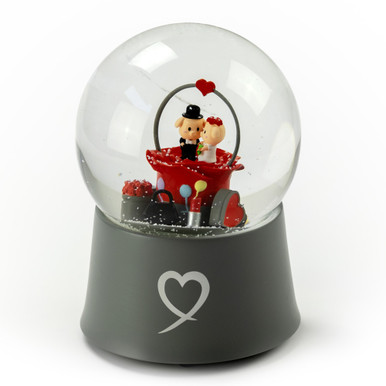 https://cdn11.bigcommerce.com/s-ojupdjoifk/products/2069/images/17823/precious-little-piggys-wedding-couple-sitting-in-rose-bud-18-note-musical-snow-globe__55470.1627417432.386.513.jpg?c=1